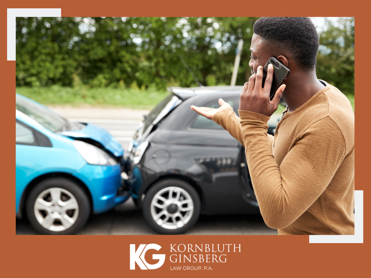 Man calling an ambulance after a car accident