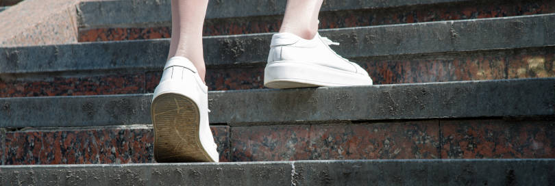 person walking up steps