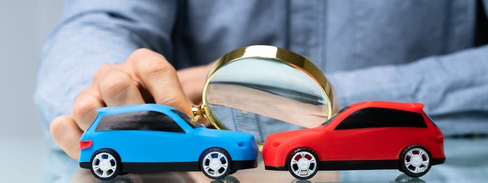 Car Insurance Expert Investigating Vehicle Accident Using Magnifying Glass