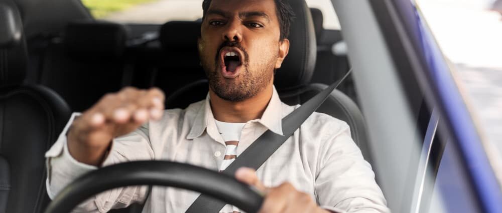 angry driver driving a car